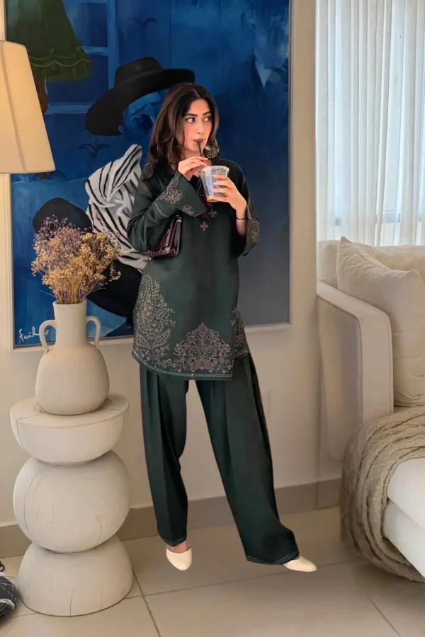 Pakistani actress Sajal Aly wearing a dark green embroidered 2-piece cotton suit with wide-leg trousers Lubaba Luxury.