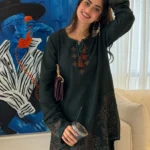 Pakistani actress Sajal Aly wearing a dark green embroidered 2-piece cotton suit with wide-leg trousers Lubaba Luxury.