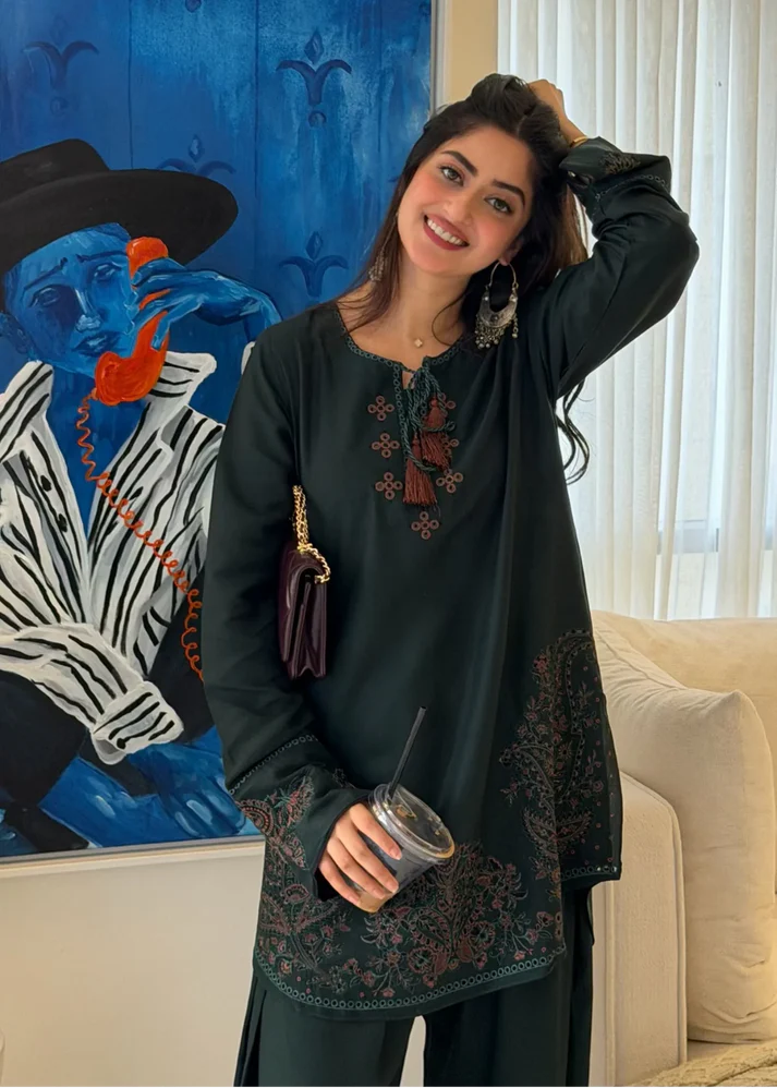 Pakistani actress Sajal Aly wearing a dark green embroidered 2-piece cotton suit with wide-leg trousers Lubaba Luxury.