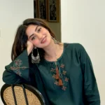Pakistani actress Sajal Aly wearing a dark green embroidered 2-piece cotton suit with wide-leg trousers Lubaba Luxury.