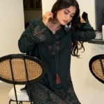 Pakistani actress Sajal Aly wearing a dark green embroidered 2-piece cotton suit with wide-leg trousers Lubaba Luxury.