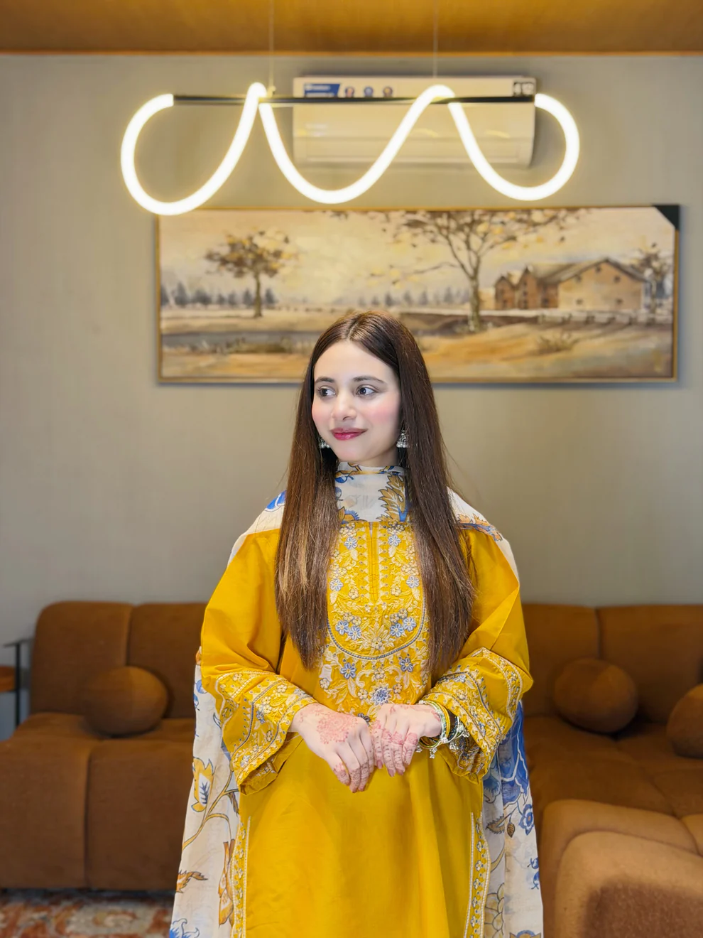A mustard yellow 3-piece embroidered cotton suit with a Munaar dupatta, featuring white lace detailing on the sleeves and hem Lubaba Luxury.