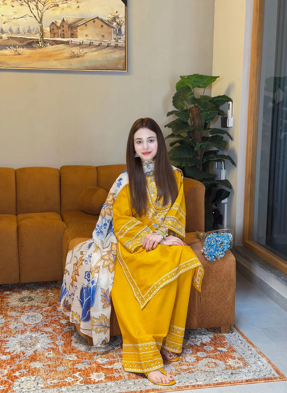A mustard yellow 3-piece embroidered cotton suit with a Munaar dupatta, featuring white lace detailing on the sleeves and hem Lubaba Luxury.