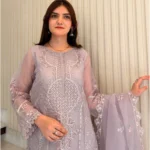 Woman wearing a lilac 3-piece embroidered organza suit with a matching dupatta and trousers lubaba luxury.