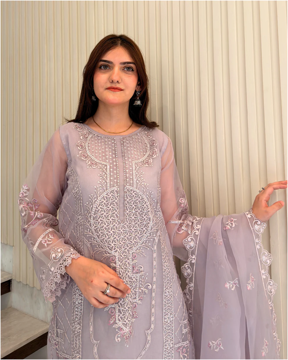 Woman wearing a lilac 3-piece embroidered organza suit with a matching dupatta and trousers lubaba luxury.