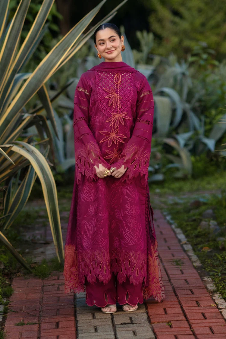 Model wearing Rang Rasiya Ayra unstitched luxury lawn 3-piece suit in plum with embroidered chikan shirt and khaddi net dupatta lubaba luxury.
