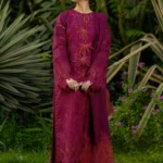 Model wearing Rang Rasiya Ayra unstitched luxury lawn 3-piece suit in plum with embroidered chikan shirt and khaddi net dupatta lubaba luxury.