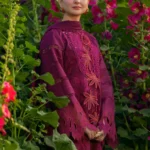 Model wearing Rang Rasiya Ayra unstitched luxury lawn 3-piece suit in plum with embroidered chikan shirt and khaddi net dupatta lubaba luxury.