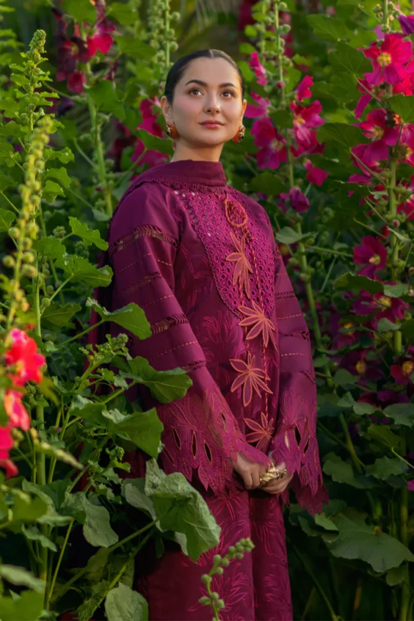 Model wearing Rang Rasiya Ayra unstitched luxury lawn 3-piece suit in plum with embroidered chikan shirt and khaddi net dupatta lubaba luxury.