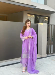 Women wearing a lavender purple embroidered chiffon 3-piece suit with a long straight shirt and matching dupatta from Lubaba Luxury.