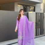 Women wearing a lavender purple embroidered chiffon 3-piece suit with a long straight shirt and matching dupatta from Lubaba Luxury.
