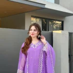 Women wearing a lavender purple embroidered chiffon 3-piece suit with a long straight shirt and matching dupatta from Lubaba Luxury.