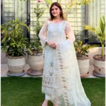 White 3-piece organza suit with intricate embroidery and a matching net dupatta by Lubaba Luxury.