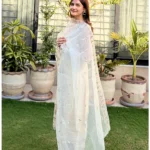 White 3-piece organza suit with intricate embroidery and a matching net dupatta by Lubaba Luxury.