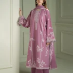 Model wearing a mauve Cross Stitch Orchid Glaze 3-piece embroidered lawn suit with a matching dupatta lubaba luxury.