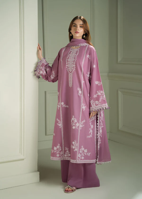 Model wearing a mauve Cross Stitch Orchid Glaze 3-piece embroidered lawn suit with a matching dupatta lubaba luxury.
