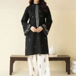 Close-up of Black embroidered lawn shirt with white threadwork and matching trousers.