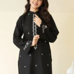 Close-up of Black embroidered lawn shirt with white threadwork and matching trousers.