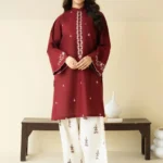 Close-up of Maroon embroidered lawn shirt with white threadwork and matching trousers.