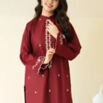 Close-up of Maroon embroidered lawn shirt with white threadwork and matching trousers.