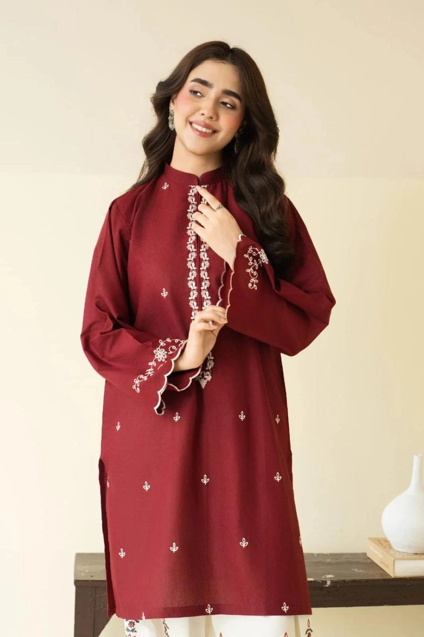 Close-up of Maroon embroidered lawn shirt with white threadwork and matching trousers.